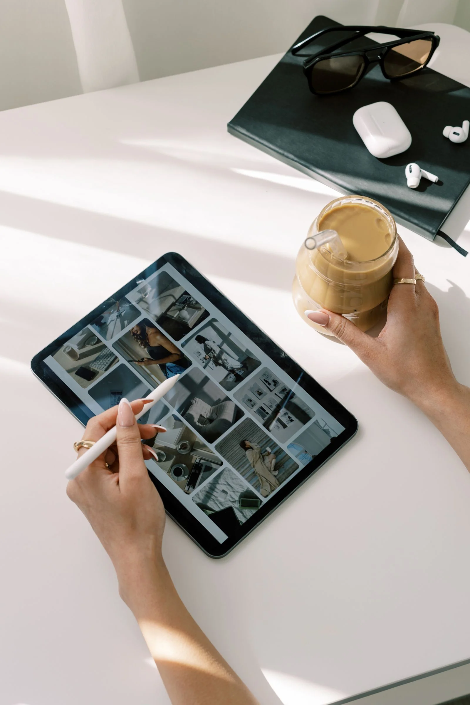 business owner scrolling through haute stock photos to use